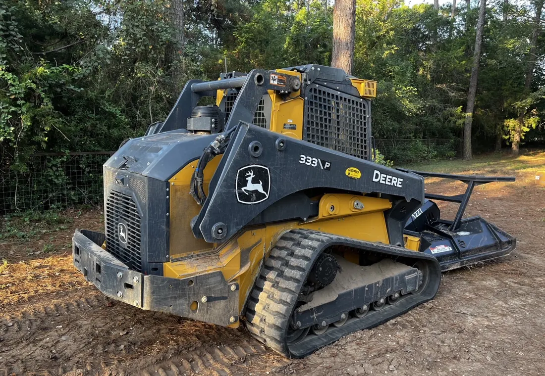 The truck and the track loader loaded up at the end of a pond grading job